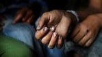 The hands of a bonded child labourer are seen as he sits in a police van after being rescued during a raid by workers.(File Photo / AP) The hands of a bonded child labourer are seen as he sits in a police van after being rescued during a raid by workers.(File Photo / AP)