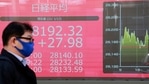 A man walks by an electronic stock board of a securities firm in Tokyo, Wednesday, Jan. 13, 2021. Asian stock markets were mixed Wednesday after Wall Street rebounded, shrugging off uncertainty about a possible new attempt to impeach President Donald Trump over last week's attack on the U.S. Capitol. (AP Photo/Koji Sasahara)(AP) A man walks by an electronic stock board of a securities firm in Tokyo, Wednesday, Jan. 13, 2021. Asian stock markets were mixed Wednesday after Wall Street rebounded, shrugging off uncertainty about a possible new attempt to impeach President Donald Trump over last week's attack on the U.S. Capitol. (AP Photo/Koji Sasahara)(AP)