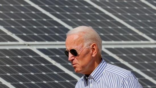 FILE PHOTO: Democratic 2020 U.S. presidential candidate and former Vice President Joe Biden walks past solar panels while touring the Plymouth Area Renewable Energy Initiative in Plymouth, New Hampshire, U.S., June 4, 2019. REUTERS/Brian Snyder/File Photo/File Photo(REUTERS)