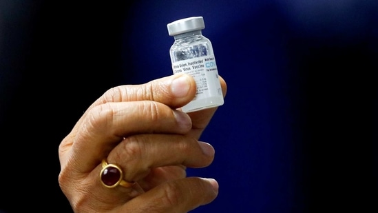 Indian Health Minister Harsh Vardhan holds a dose of Bharat Biotech's Covid-19 vaccine called Covaxin, during a vaccination campaign in New Delhi, India. (REUTERS)