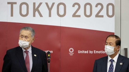 Tokyo Olympic and Paralympic Games Organising Committee (TOGOC) President Yoshiro Mori (L) and CEO Toshiro Muto speak to the media after a video conference with IOC President Thomas Bach at the TOGOC headquarters in Tokyo, Japan January 28, 2021. (REUTERS)