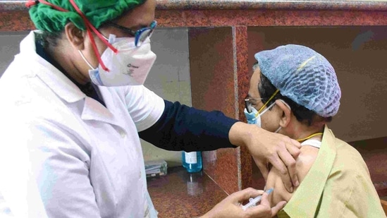 A medic administers the COVID-19 vaccine to the frontline worker during a vaccination drive in Kolkata on Monday. (ANI) A medic administers the COVID-19 vaccine to the frontline worker during a vaccination drive in Kolkata on Monday. (ANI)