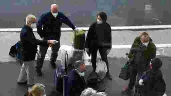 Members of a WHO team arrives in Wuhan in central China's Hubei province on January 14, 2021.(AP)