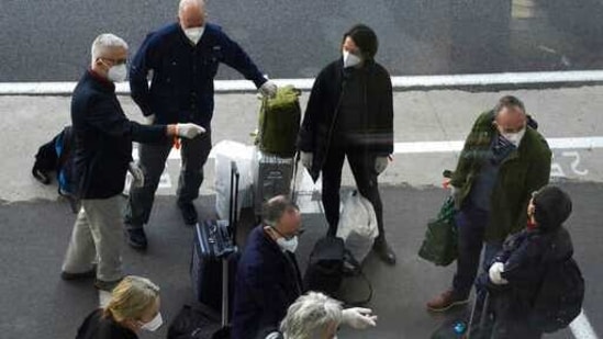 Members of a WHO team arrives in Wuhan in central China's Hubei province on Thursday, Jan. 14, 2021. The global team of researchers arrived Thursday in the Chinese city where the coronavirus pandemic was first detected to conduct a politically sensitive investigation into its origins amid uncertainty about whether Beijing might try to prevent embarrassing discoveries. (AP Photo/Ng Han Guan)(AP) Members of a WHO team arrives in Wuhan in central China's Hubei province on Thursday, Jan. 14, 2021. The global team of researchers arrived Thursday in the Chinese city where the coronavirus pandemic was first detected to conduct a politically sensitive investigation into its origins amid uncertainty about whether Beijing might try to prevent embarrassing discoveries. (AP Photo/Ng Han Guan)(AP)