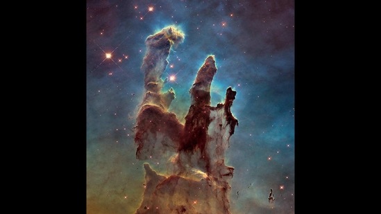 NASA's Hubble Space Telescope has revisited the famous Pillars of Creation, revealing a sharper and wider view of the structures in this visible-light image. The towering pillars are about 5 light-years tall.(Photo Credit: NASA, ESA, and the Hubble Heritage Team (STScI/AURA))