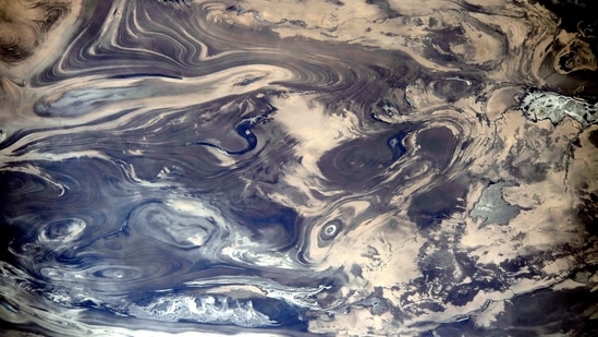 A close-up from afar, the International Space Station captured this shot of Iran’s arid Kavir region in 2014. The marbled region is some 65-km across, featuring rock formations and erosion. The dark path in the centre is a lake, the odd lighter patch next to it is a sand sheet.(Photo courtesy NASA/ ISS; CEO)