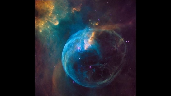 Another Hubble gem, this show of the Bubble nebula, 7,100 light-years away from Earth in the constellation Cassiopeia, features a star that is 45 times larger than our sun.(Photo courtesy NASA, ESA, and the Hubble Heritage Team (STScI/AURA))