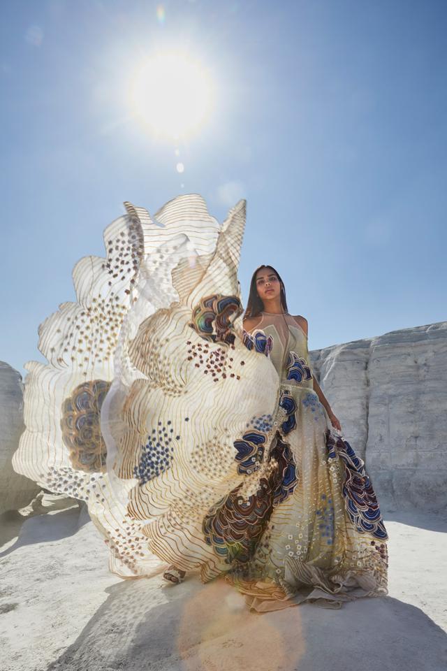 A model in a voluminous gowns with a dramatic trains that unfurled against the impressionist sky. (Photo: Instagram/RahulMishra_7) A model in a voluminous gowns with a dramatic trains that unfurled against the impressionist sky. (Photo: Instagram/RahulMishra_7)