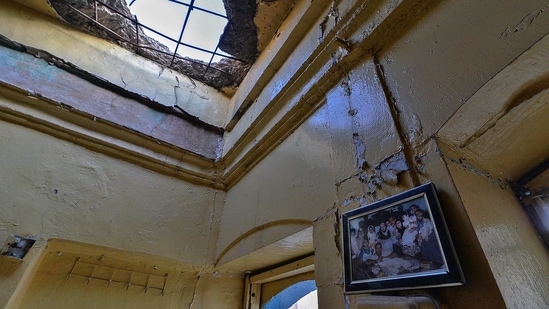A family picture hangs on the wall of a heavily damaged house in the Old City of Mosul on January 26.(Zaid AL-Obeidi / AFP)