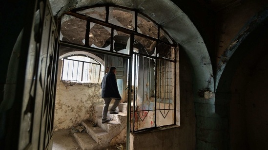 An Iraqi man walks inside a heavily damaged house in the Old City of Mosul on January 26. According to local authorities, Mosul has sent 90,000 requests for compensation to the central government, including 40,000 for the loss of a loved one and 50,000 for destroyed property, reported AFP.(Zaid AL-Obeidi / AFP)