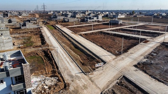 A drone image shows the Zayouna housing complex under construction to be put out for sale in the suburb of Zayouna, on the southern outskirts of Iraq's northern city of Mosul on January 18. (Zaid AL-Obeidi / AFP)