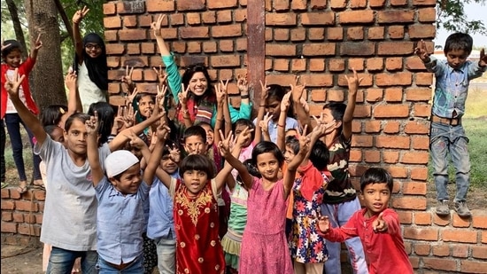 Rajshri Deshpande with the children of Pandhari. She helped rebuild the crumbling local zilla parishad school and has set up a sewing centre for women in a neighbouring village too. She continues to work as an actor. “I want to continue doing memorable things in both worlds,” she says.