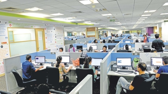 Office workers work amid a busy day in a startup company in Mumbai. (HT Archive)