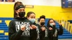 Manchester Township High School basketball player wear Black Lives Matter sweatshirts before warming up for a game.(AP)