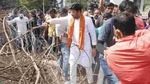 Angry at the presence of a large number of police personnel who allegedly tried to stop them, the BJYM activists led by MP Tejaswi Surya forcibly removed the barricades and entered the varsity campus.(PHOTO CREDIT: BJP.)