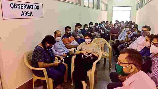 Vaccine beneficiaries wait at the observation room after getting the vaccine at BYL Nair Hospital. (Anshuman Poyrekar/HT Photo)