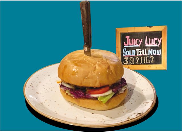 At Café Delhi Heights the Juicy Lucy burgers are such hot-sellers that the restaurant has a board with the number of hamburgers sold
