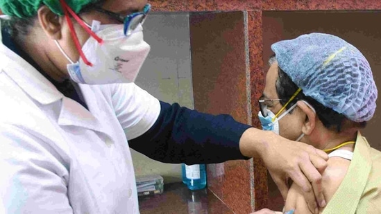 A medic administers the Covid-19 vaccine to the frontline worker during a vaccination drive in Kolkata. (ANI)