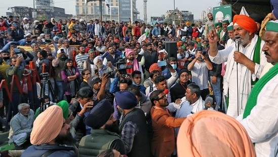 BKU leader Rakesh Tikait addresses farmers during a protest against the three farm laws at Delhi Ghazipur border in New Delhi on Saturday. (ANI Photo)