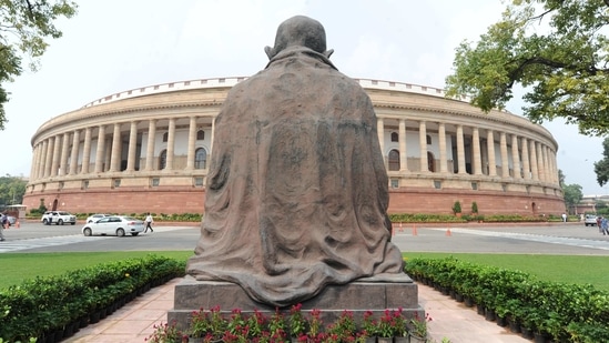 A Mahatma Gandhi statue overlooks the Parliament building as lawmakers prepare for upcoming Budget session. (AP Photo) A Mahatma Gandhi statue overlooks the Parliament building as lawmakers prepare for upcoming Budget session. (AP Photo)