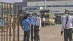 Security personnel stand guard outside Wistron Infocomm Manufacturing India Pvt Ltd, where a section of workers went on a rampage at its facility manufacturing Apple iPhones and other products over non-payment of promised wage, at Narasapura area in Bengaluru, Sunday, Dec. 13, 2020.(PTI) Security personnel stand guard outside Wistron Infocomm Manufacturing India Pvt Ltd, where a section of workers went on a rampage at its facility manufacturing Apple iPhones and other products over non-payment of promised wage, at Narasapura area in Bengaluru, Sunday, Dec. 13, 2020.(PTI)