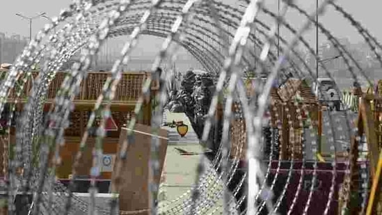 Barbed wire put across a road at Ghazipur border during the farmers' protest, in New Delhi. (PTI Photo)