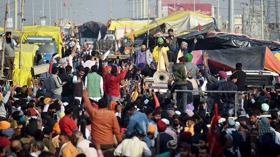 Punjabi singers Kanwar Grewal and Harf Cheema reach farmers' protest site against new farm laws at Delhi-Ghazipur border, in Delhi on Sunday. (ANI Photo)