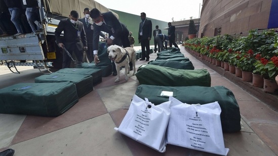 Security personnel scan sacks containing copies of the budget for FY 2021-22, during the Budget Session on February 1. The finance minister announced a slew of measures to aid the recovery of the economy battered by the coronavirus disease (Covid-19). There was also an eye on the upcoming Assembly elections in four states as the finance minister announced infrastructure projects for Tamil Nadu, Kerala, Assam and West Bengal.(Manvender Vashisht / PTI)
