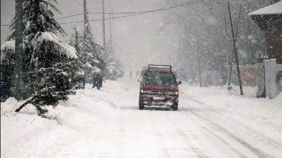 A vehicle plies on a snow-covered road after heavy snowfall, in Baramulla district of J&K. (ANI) A vehicle plies on a snow-covered road after heavy snowfall, in Baramulla district of J&K. (ANI)