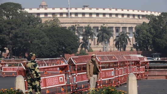 Security personnel stand guard next to barricades outside the Parliament while the annual budget is being presented on February 1. To push growth via infrastructure creation, Finance Minister Nirmala Sitharaman hiked the government's capital expenditure for FY 2021-22 by 34.5 per cent to <span class='webrupee'>₹</span>5.5 lakh crore.(Anushree Fadnavis / REUTERS)