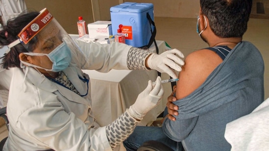 A medic administers the dose of Covid-19 vaccine on a beneficiary during the vaccination drive across the country, at a district hospital in Noida, Friday, Jan. 29, 2021. (PTI) A medic administers the dose of Covid-19 vaccine on a beneficiary during the vaccination drive across the country, at a district hospital in Noida, Friday, Jan. 29, 2021. (PTI)