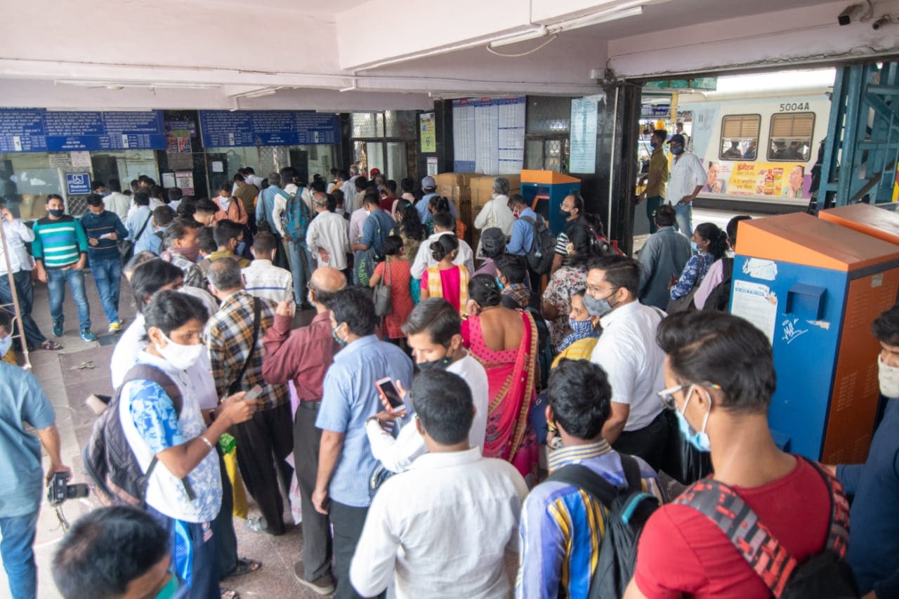 People stand in queue for the local train ticket on the first day when local train services starts for general public at Dadar in Mumbai on Monday. (Pratik Chorge/HT Photo ) People stand in queue for the local train ticket on the first day when local train services starts for general public at Dadar in Mumbai on Monday. (Pratik Chorge/HT Photo )