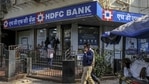 Pedestrian walk past an HDFC Bank Ltd. branch in Mumbai, India,(Bloomberg) Pedestrian walk past an HDFC Bank Ltd. branch in Mumbai, India,(Bloomberg)
