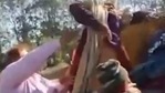 A homeless woman in Indore is being hauled into a truck during homeless person's eviction drive. (Editorji/Twitter)