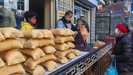 A woman out shopping in Dharamshala on January 31. The first case of Covid-19 was confirmed in India on January 30, 2020, when an Indian student of the Wuhan University in China detected positive in Kerala. A year later, India is at fourth position globally as far as cumulative toll is concerned and second in terms of overall cases.(Ashwini Bhatia / AP)