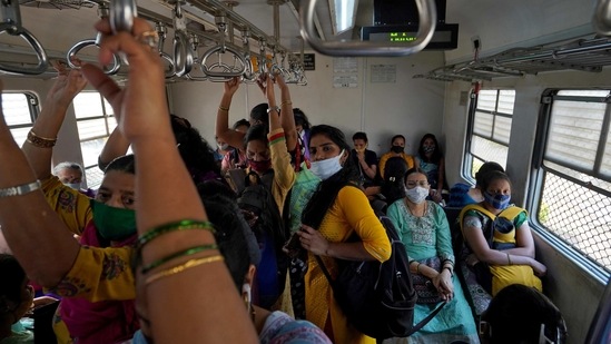 Women travel in a suburban train in Mumbai on February 1. In another significant development, the country has reported 94 daily deaths in the last 24 hours, lowest in eight and half months, the health ministry said. A figure of under 100 fatalities was last recorded on May 15, 2020.(Hemanshi Kamani / REUTERS)