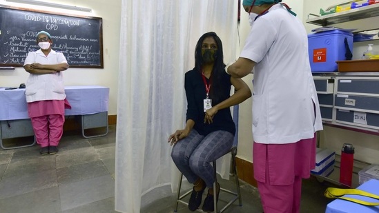 A beneficiary gets vaccinated against Covid-19 at Nair Hospital in Mumbai on February 1. Presenting the Union Budget for the coming financial year, Finance Minister Nirmala Sitharaman on February 1, announced an allocation of <span class='webrupee'>₹</span>35,000 crore for Covid-19 vaccines. (Anshuman Poyrekar / HT Photo)