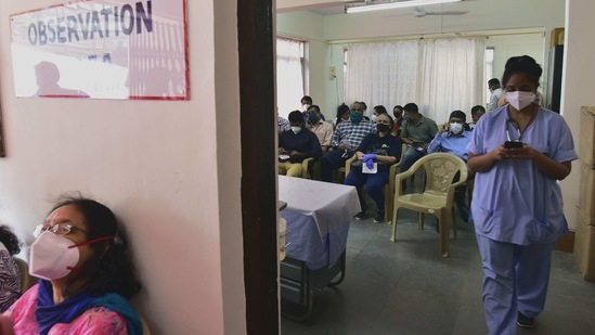 People waiting in observation rooms after being administered Covid-19 vaccine shots at Nair Hospital in Mumbai on February 1. The finance minister also announced a new centrally sponsored scheme, Prime Minister Atmanirbhar Swasth Bharat Yojana, which would be launched with an outlay of about 64,180 crore over six years.(Anshuman Poyrekar)