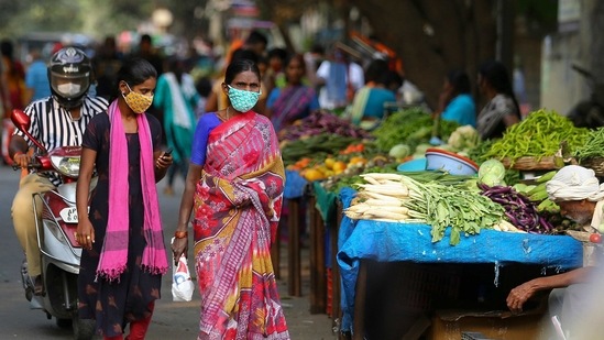 A couple of women out buying vegetables in Hyderabad on January 30. Adding to this string of milestones achieved by the country in battle against Covid-19, the ministry said that the active caseload, which stands at 1,63,353 as of February 1, is just 1.52%t of India’s total positive cases.(Mahesh Kumar A. / AP)