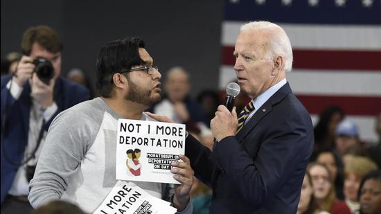 Then Democratic presidential hopeful Joe Biden talks with a protester objecting to his stance on deportations during a town hall at Lander University on November 21, 2019. (AP file) Then Democratic presidential hopeful Joe Biden talks with a protester objecting to his stance on deportations during a town hall at Lander University on November 21, 2019. (AP file)