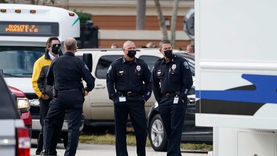 Law enforcement officers block an area where a shooting wounded several FBI agents while serving an arrest warrant, (AP) Law enforcement officers block an area where a shooting wounded several FBI agents while serving an arrest warrant, (AP)