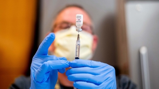 FILE - In this Jan. 12, 2021, file photo Pharmacist Brian Kiefer draws saline while preparing a dose of Pfizer's COVID-19 vaccine at UC Davis Health in Sacramento, Calif. Mutations to the virus that causes COVID-19 are rapidly popping up and health officials say the pandemic could get worse unless people do more to curb cases. So far, vaccines seem to remain effective against the new variants, but the longer it takes to vaccinate people, the more likely it is that a virus that can elude defenses could emerge. (AP Photo/Noah Berger, Pool, File) (AP) FILE - In this Jan. 12, 2021, file photo Pharmacist Brian Kiefer draws saline while preparing a dose of Pfizer's COVID-19 vaccine at UC Davis Health in Sacramento, Calif. Mutations to the virus that causes COVID-19 are rapidly popping up and health officials say the pandemic could get worse unless people do more to curb cases. So far, vaccines seem to remain effective against the new variants, but the longer it takes to vaccinate people, the more likely it is that a virus that can elude defenses could emerge. (AP Photo/Noah Berger, Pool, File) (AP)