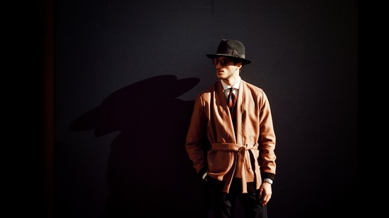A Pitti peacock accessorises his camel coat ensemble with a nifty fedora hat as he soaks in the Florentine sun. (Photo: Instagram/Pitti_Uomo) A Pitti peacock accessorises his camel coat ensemble with a nifty fedora hat as he soaks in the Florentine sun. (Photo: Instagram/Pitti_Uomo)