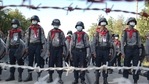 Police stand guard behind barbed wire as they attempt to stop protesters outside Union Election Commission office in Naypyitaw,(AP) Police stand guard behind barbed wire as they attempt to stop protesters outside Union Election Commission office in Naypyitaw,(AP)