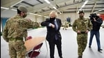 British Prime Minister Boris Johnson meets troops as they set up a vaccination centre in the Castlemilk district of Glasgow, Scotland, Britain on January 28, 2021. (REUTERS)