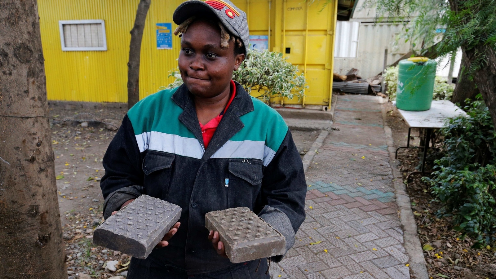 woman-in-kenya-recycles-plastic-waste-into-bricks-stronger-than