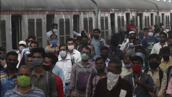 Indian commuters crowd CSMT in Mumbai on February 1, 2021 after trains were allowed to resume for public. (AP) Indian commuters crowd CSMT in Mumbai on February 1, 2021 after trains were allowed to resume for public. (AP)
