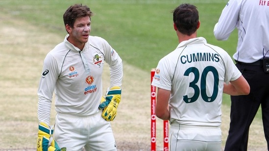 Australian captain Tim Paine, left, talks with bowler Pat Cummins during play on day three of the fourth cricket test between India and Australia at the Gabba, Brisbane, Australia, Sunday, Jan. 17, 2021. (AP Photo/Tertius Pickard) (AP) Australian captain Tim Paine, left, talks with bowler Pat Cummins during play on day three of the fourth cricket test between India and Australia at the Gabba, Brisbane, Australia, Sunday, Jan. 17, 2021. (AP Photo/Tertius Pickard) (AP)