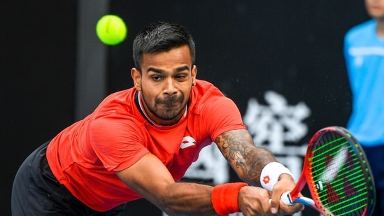 India's Sumit Nagal makes a backhand return to Lithuania's Ricardas Berankis during a tuneup tournament ahead of the Australian Open tennis championships in Melbourne, Australia, Monday, Feb. 1, 2021. (AP) India's Sumit Nagal makes a backhand return to Lithuania's Ricardas Berankis during a tuneup tournament ahead of the Australian Open tennis championships in Melbourne, Australia, Monday, Feb. 1, 2021. (AP)
