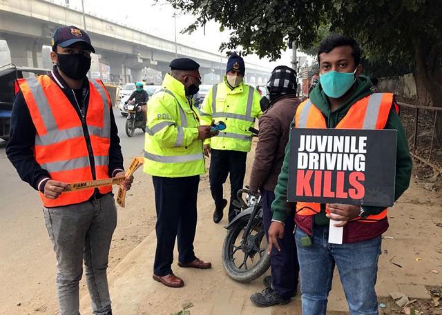 Several volunteers have been stationed at various spots, to hold placards with road safety rules. Several volunteers have been stationed at various spots, to hold placards with road safety rules.